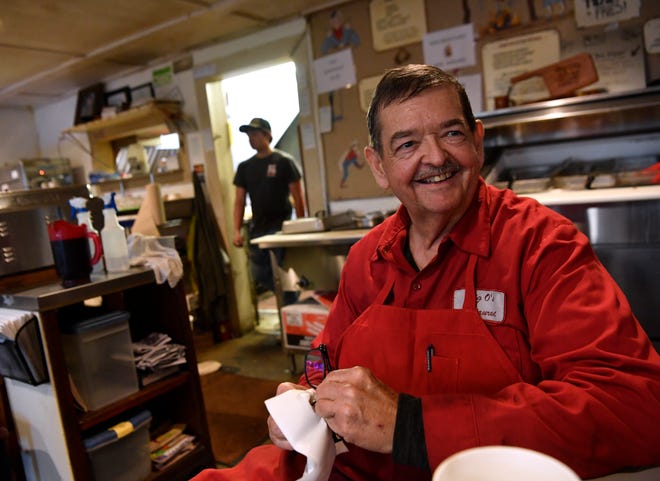 Lynn Owens, the own of Big O's Restaurant in Valera, sits down for a few minutes during a busy Friday last week. He said he is honored that another restaurant, Rancho Pizzeria in Coleman, has created a pizza using his brisket