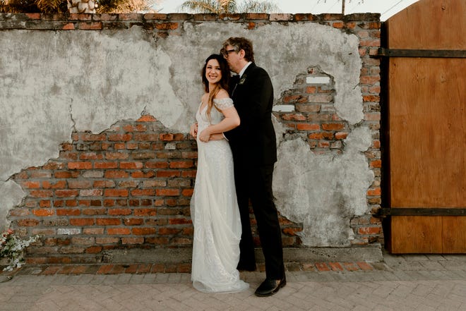 In this April 20, 2019, photo provided by Katch Silva, Michelle Branch and Patrick Carney pose for a photo in New Orleans. The Grammy-winning musicians tied the knot Saturday at the Marigny Opera House in front of close friends and family, a representative for Carney told The Associated Press on Sunday.