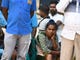 Relatives of Sri Lankan victims sit outside a hospital in Batticaloa Sri Lanka on April 21, 2019. 