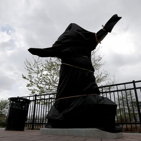The covered Kate Smith statue sits outside Wells...