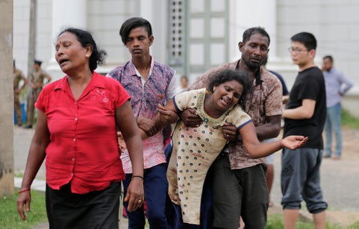 Relatives of blast victims grieve outside a morgue in Colombo, Sri Lanka on April 21, 2019. At least six different explosions were reported to hit hotels and churches as worshippers gathered for Easter services in the cities of Colombo, Negombo and Batticaloa, according to the Associated Press. 