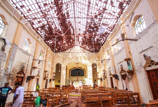 Sri Lankan officials inspect St. Sebastian's Church in Negombo, Sri Lanka after an explosion on April 21, 2019.