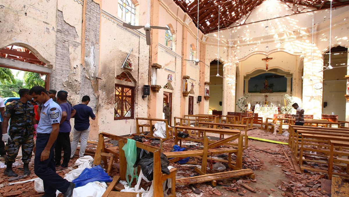 Sri Lankan officials inspect St. Sebastian's Church in Negombo, Sri Lanka after an explosion on April 21, 2019.