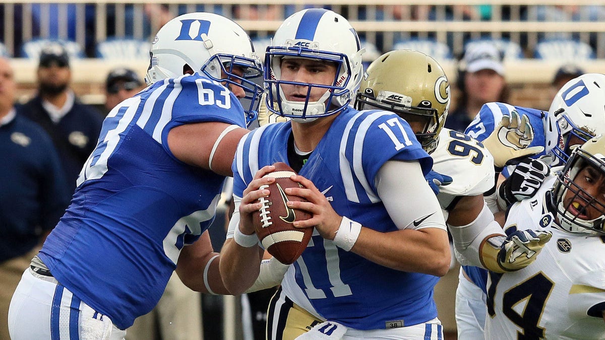 Duke Blue Devils quarterback Daniel Jones (17) looks for a receiver against the Georgia Tech Yellow Jackets defense in the first half at Wallace Wade Stadium.