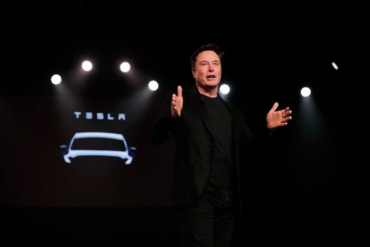 In this March 14, 2019, file photo Tesla CEO Elon Musk speaks before unveiling the Model Y at Tesla's design studio in Hawthorne, Calif.