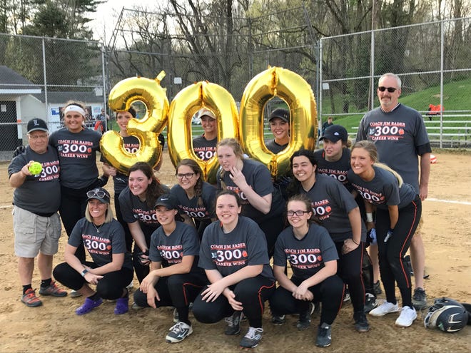 The Lucas Lady Cubs pose with head coach Jim Rader (Far left, back row) after he earned his 300th career victory and 100th at Lucas last week.