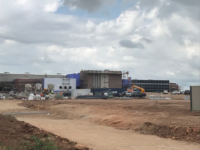 Crews continue building the Wylie East Junior High School on Colony Hill Road on Tuesday. District trustees will consider approving a football field and track complex, as well as tennis courts, at the school during a special meeting at 8 a.m. Friday.
