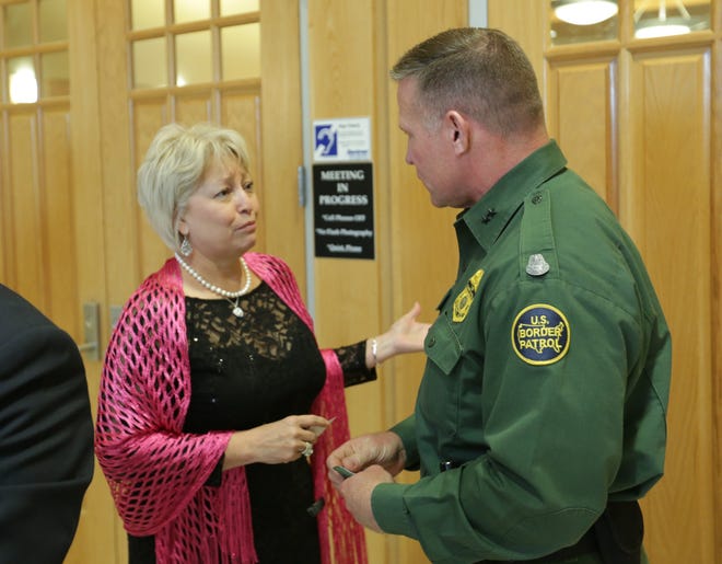 Doña Ana County Commissioner Isabella Solis, left, speaks on Tuesday, April 23, 2019 with Chief Patrol Agent Aaron Hull of the U.S. Border Patrol's El Paso Sector. Hull addressed commissioners during a regular meeting at the county building, 845 N. Motel Blvd., Las Cruces.