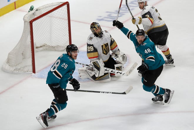 Golden Knights goaltender Marc-Andre Fleury, center, reacts between Sharks right wing Timo Meier (28) and center Tomas Hertl (48) after Logan Couture scored a goal during the third period of Game 7 on Tuesday.