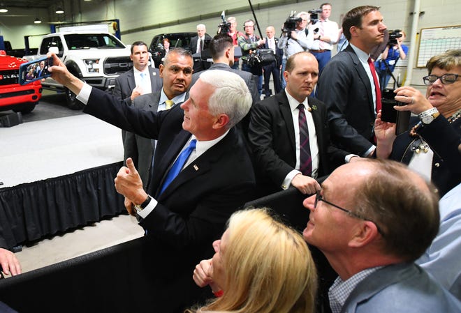 Vice President Mike Pence takes a selfie with Beth Ann Rodgers and husband Steve Rodgers before giving a speech on the United States-Mexico-Canada Agreement at Motor City Solutions in Taylor.