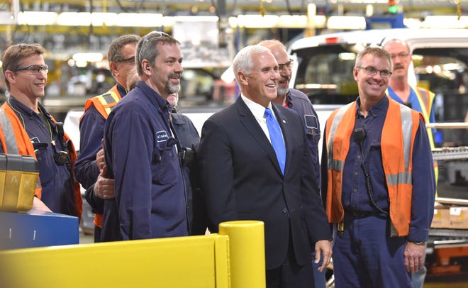 Vice President Mike Pence poses for a group shot with workers at Ford Motor Co.'s Dearborn Truck Plant.