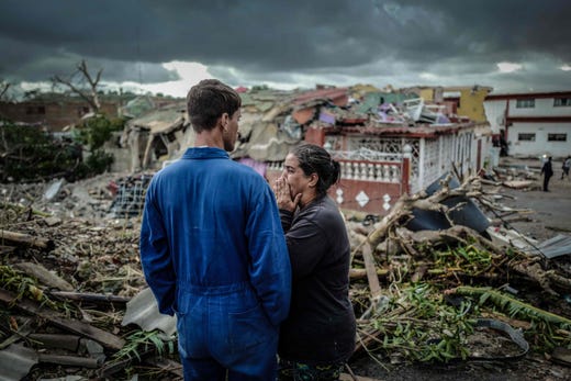 TOPSHOT - A resident of tornado-hit Regla neighbourhood cries in front of her destroyed house, in Havana, on January 28, 2019. - A rare and powerful tornado that struck Havana killed three people and left 172 injured, Cuban President Miguel Diaz-Canel said early Monday. (Photo by ADALBERTO ROQUE / AFP)ADALBERTO ROQUE/AFP/Getty Images ORIG FILE ID: AFP_1CR81H