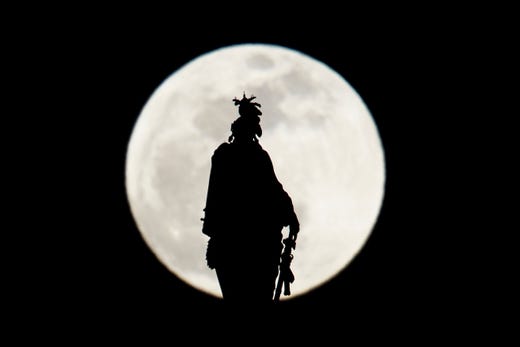 TOPSHOT - The Statue of Freedom on top of the US Capitol dome is seen silhouetted against the super moon on January 20, 2019 in Washington, DC. (Photo by Brendan Smialowski / AFP)BRENDAN SMIALOWSKI/AFP/Getty Images ORG XMIT: Super "Bl ORIG FILE ID: AFP_1CF6X7