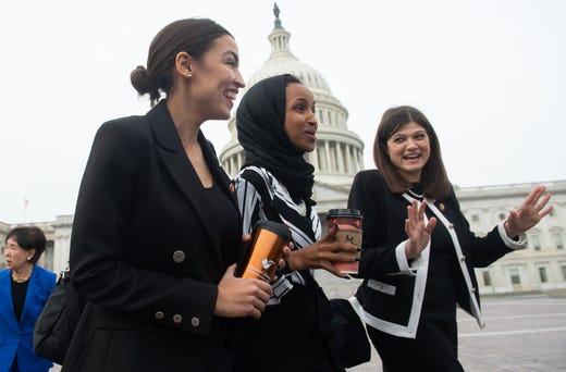 US Representatives Alexandria Ocasio-Cortez, (D-NY); Ilhan Omar (D-MN); and Haley Stevens (R), (D-MI), arrive for a photo opportunity with the female House Democratic members of the 116th Congress outside the US Capitol in Washington, DC, Jan. 4, 2019.