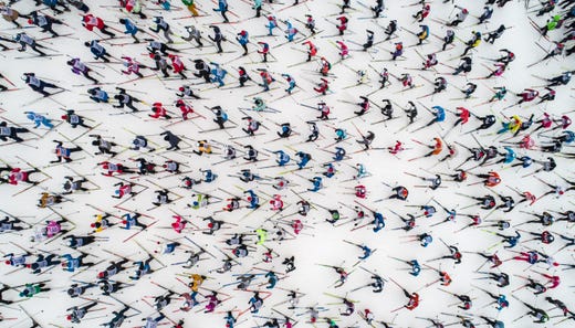 Skiing enthusiasts start in the traditional mass skiing competition "Ski-track of Russia," just outside Moscow, Russia, Feb. 9, 2019. About 20,000 skiing amateurs as well as famous sportsmen compete Saturday in the 10 km race, with temperature around the course around 32 degrees Farenheit, but due to high humidity and wind, weather experts said it would feel more like 23 F.