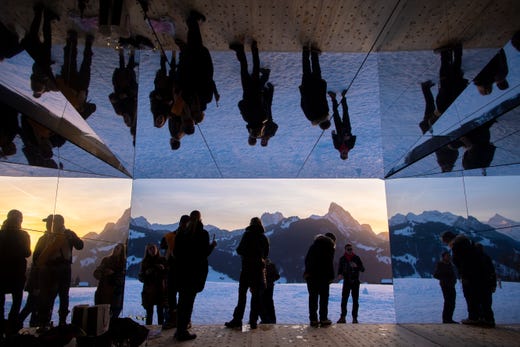 People visit the installation called 'Mirage Gstaad' by American artist Doug Aitken, in Gstaad, Switzerland on Feb. 20, 2019. This structure was presented during the exhibition 'Elevation 1049: Frequencies'. It will be visible for the next two years.