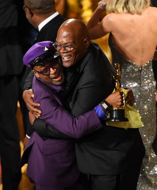 Spike Lee celebrates with Samuel L. Jackson as Lee accepts the award for best adapted screenplay for "BlacKkKlansman" during the 91st Academy Awards at the Dolby Theatre in Los Angeles on Feb. 24, 2019.