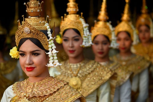 TOPSHOT - Dancers line up to perform during the Cambodian People's Party (CPP) ceremony to mark the 40th anniversary of the fall of the Khmer Rouge regime at the National Olympic Stadium in Phnom Penh on January 7, 2019.