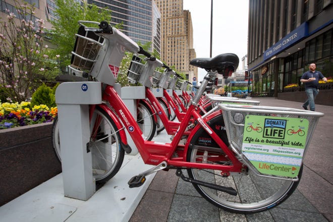 Red Bikes are parked near Fountain Square in downtown Cincinnati, Thursday, April 25, 2019.The ride share program has 442 bikes and 57 stations around the city. 