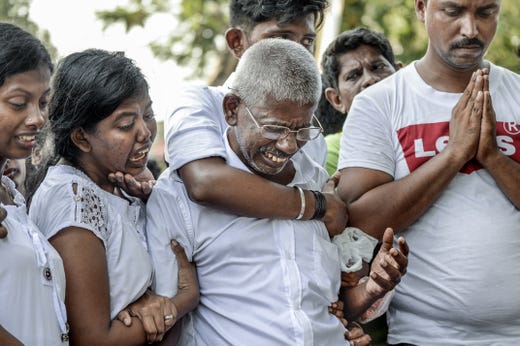 Relatives cry at the graveside during the funeral of a victim of the Easter Sunday Bombings at a local cemetery on April 24, 2019 in Colombo, Sri Lanka. At least 359 people were killed and 500 people injured after coordinated attacks on churches and hotels on Easter Sunday which rocked three churches and three luxury hotels in and around Colombo as well as at Batticaloa in Sri Lanka.