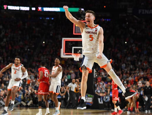 Virginia Cavaliers guard Kyle Guy celebrates winning the NCAA 2019 men's basketball championship game against the Texas Tech Red Raiders in overtime on April 8, 2019 in Minneapolis.