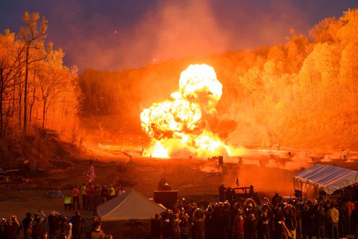 An explosion goes off at the start of the night shoot on the main firing line at the Knob Creek Machine Gun Shoot and Military Gun show in Bullitt County near West Point, Ky. on April 12, 2019. The Machine Gun Shoot and Military Gun show attracts thousands of visitors from across the country and around the world for the two day event featuring machine gun owners firing millions of rounds.