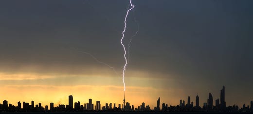 Lightning strikes the liberation tower in Kuwait City during a thunder storm on April 5, 2019.