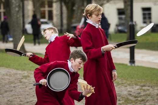 Choristers from Winchester Cathedral joke around in between posing for pictures on March 5, 2019 in Winchester, England. Winchester Cathedral held it's inaugural Shrove Tuesday Pancake day race in the Cathedral grounds with money raised going to local charities. 