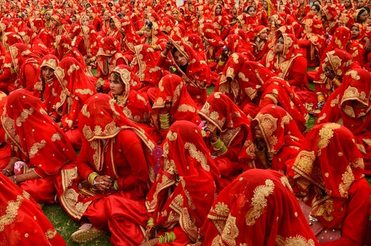 Indian Muslim brides-to-be gather as they participate in a mass wedding ceremony in Ahmedabad on March 3, 2019. 