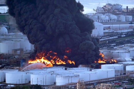Firefighters battle a large petrochemical fire at the Intercontinental Terminals Company, March 18, 2019, in Deer Park, Texas near Houston.
