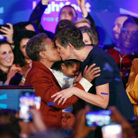 Chicago mayor elect Lori Lightfoot (L) kisses...
