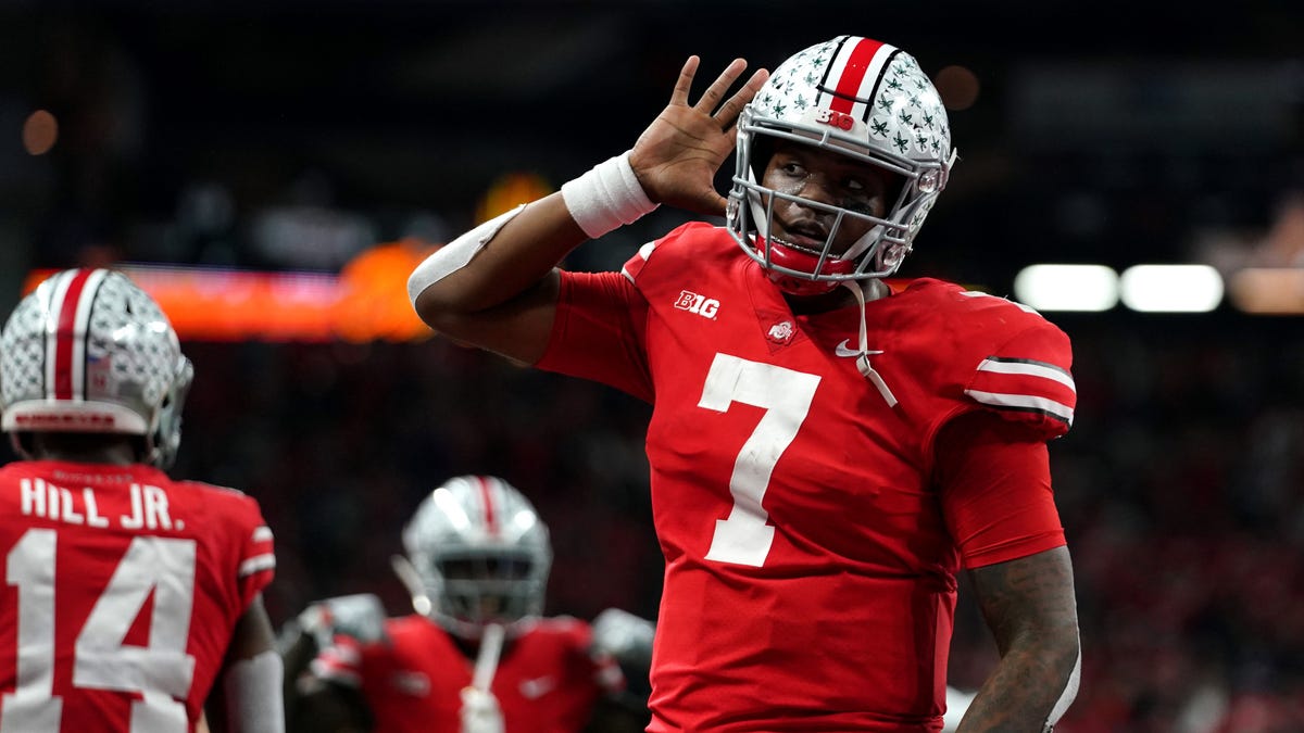 Ohio State Buckeyes quarterback Dwayne Haskins (7) celebrates with teammates after throwing a touchdown pass against the Northwestern Wildcats in the first half in the Big Ten conference championship game at Lucas Oil Stadium.