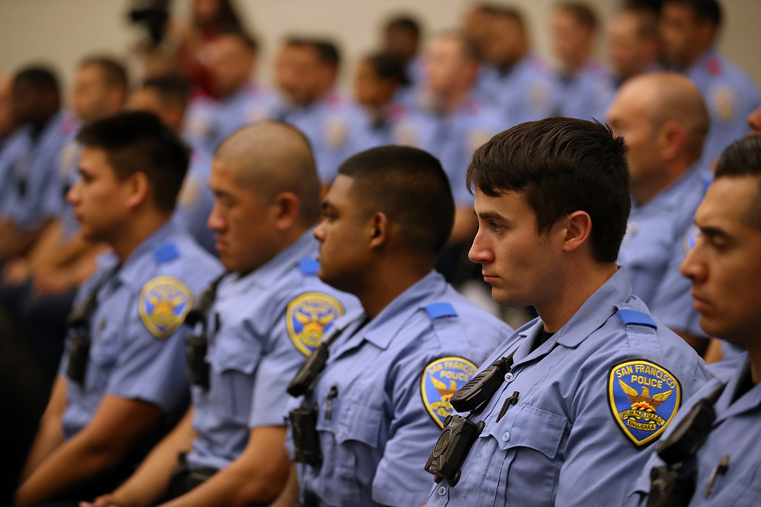 San Francisco police recruits look on during a news conference at the San Francisco Police Academy on May 15, 2018.