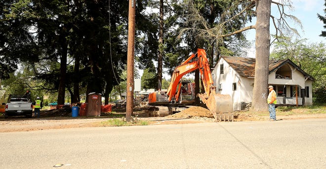 A crew works the site where the Quinault Nation plans to open a smoke shop on Callow Avenue in Bremerton on Friday.