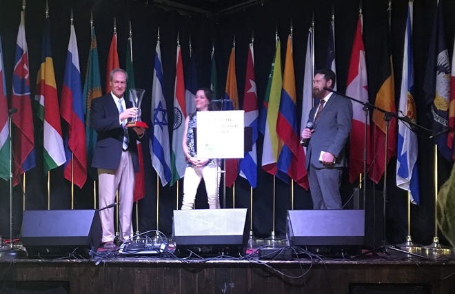 Warren Bares, president of J. Maxime Roy Inc., accepts the 20th International Achievement Award by the Lafayette International Center Foundation at the Festival International Opening Reception on Thursday, April 25, 2019.