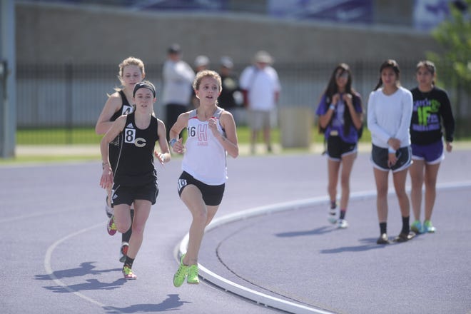 Holliday freshman Hannah Spears (16) leads the 3,200-meter run at the Region I-3A Meet at Abilene Christian University. Spears won the race, qualifying for state.