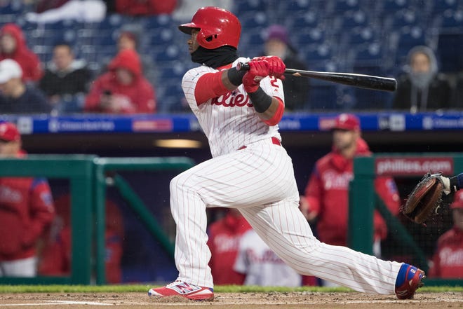 Apr 5, 2019; Philadelphia, PA, USA; Philadelphia Phillies shortstop Jean Segura (2) hits an RBI double during the first inning against the Minnesota Twins at Citizens Bank Park. Mandatory Credit: Bill Streicher-USA TODAY Sports