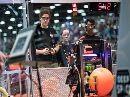 From left, Team 548 Robostangs from Northville, Rachel Reiz, May Murray and Nikith Ganan compete during the FIRST Robotics World Championship semifinal at Cobo Center in Detroit, Saturday, April 27, 2019.