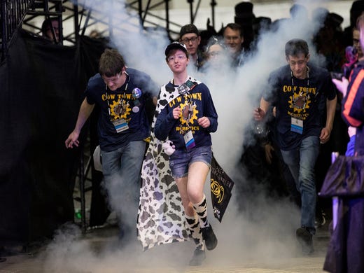 Team 5050 Cow Town Robotics from Carleton take the court as they were introduced during the FIRST Robotics World Championship semifinal at Cobo Center in Detroit, Saturday, April 27, 2019.