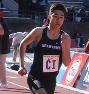 Dan Stipanov of Paramus crosses the finish line as his team won their heat in the 4x400 relay.