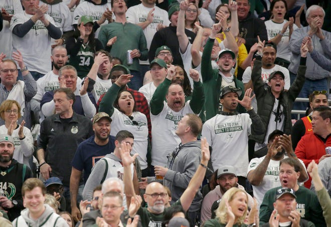 Fans cheer for the Bucks during a conference semifinal game against the Celtics at Fiserv Forum.