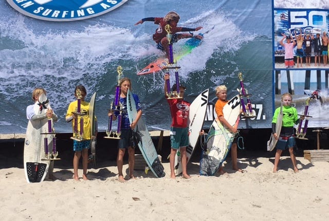 The finalists in the boys 12-under division at the ESA Southeast Regionals show off their awards.