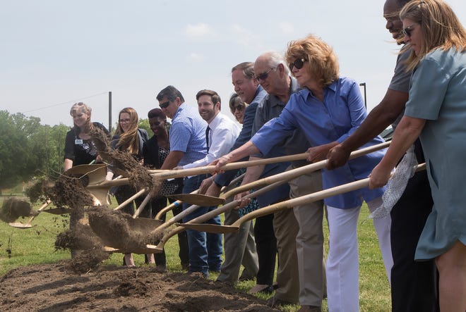 Various West Monroe officials and other community representatives shovel dirt during the ground breaking ceremony of the Riverbend Community Health Park located next to the West Monroe Community Center and Riverbend elementary on April 30 in West Monroe, La.