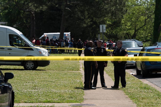 Emergency crews investigate a homicide at the Red Lion Apartments in Montgomery, Ala., on Tuesday, April 30, 2019.