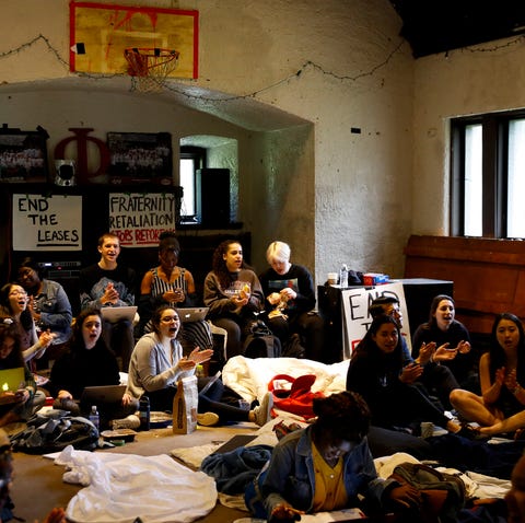 Swarthmore College students sing during a sit-in...