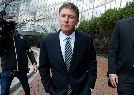 Bruce Isackson departs federal court in Boston on Wednesday, April 3, 2019, after facing charges in a nationwide college admissions bribery scandal. (AP Photos/Michael Dwyer) ORG XMIT: BX132