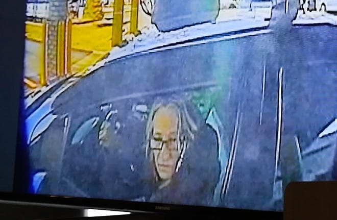 An image of Karen Spranger in her car at an ATM, one of the images shown during a press conference by Macomb County Prosecutors office.