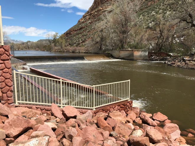 A fish ladder is shown to the left of the Watson Lake dam on the Poudre River in Bellvue.
