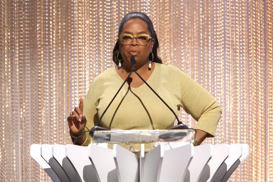 Oprah Winfrey accepts the Empowerment in Entertainment Award and talks about misogyny in the workplace at The Hollywood Reporter's luncheon Tuesday at Milk Studios.