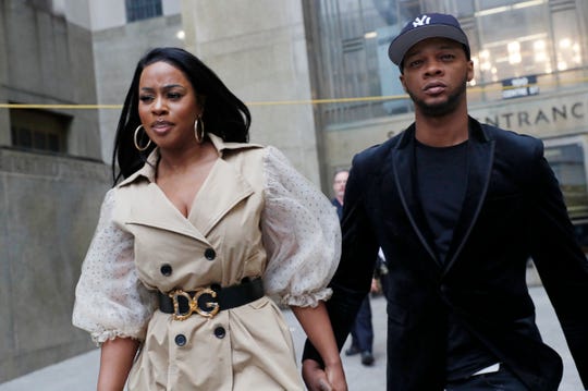 Rapper Remy Ma, left, leaves Manhattan Criminal Court, with her husband Papoose, also a rapper, after she was arraigned on a assault charge Wednesday, May 1, 2019, in New York.